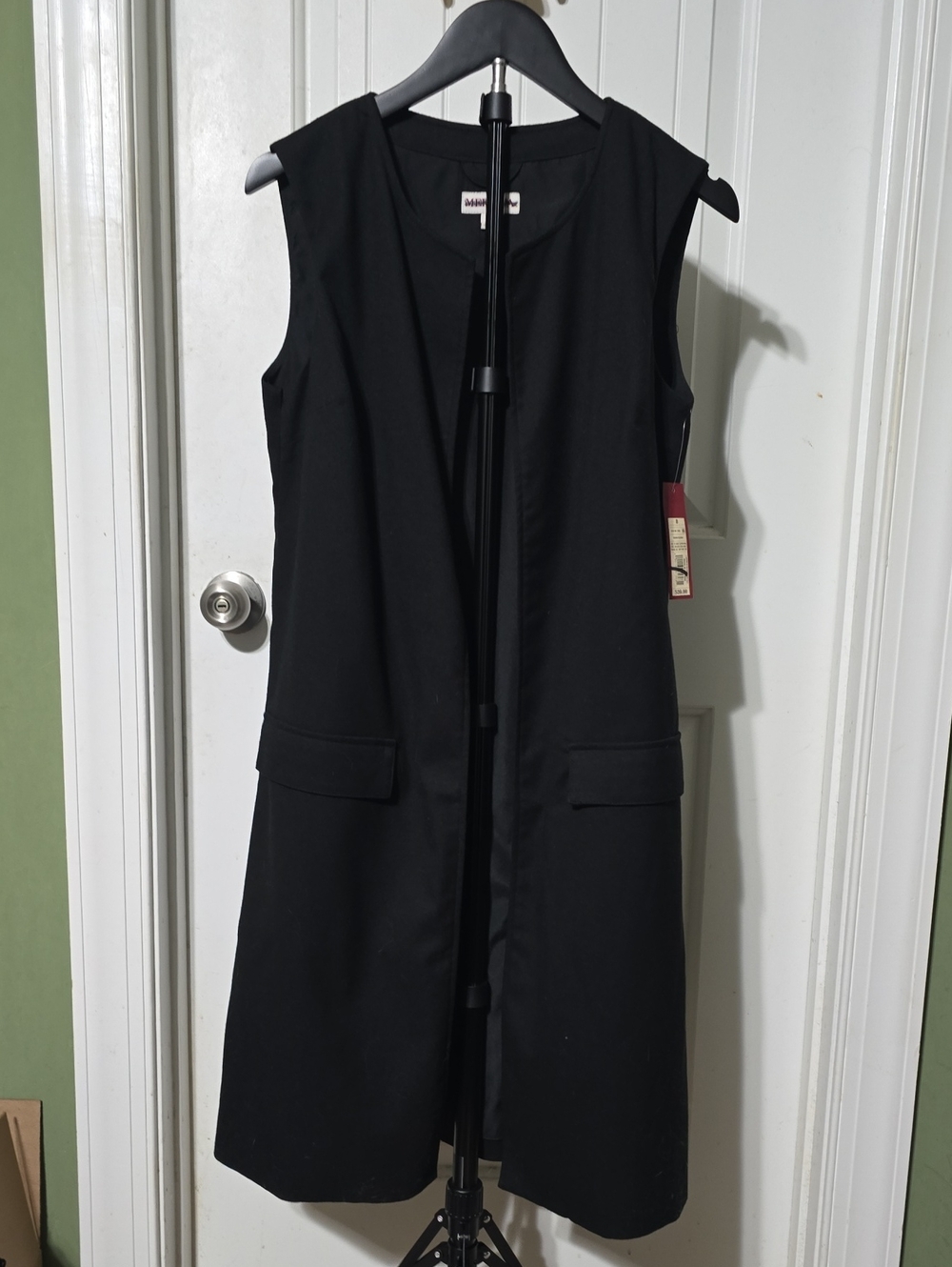 Black Sleeveless fully lined long vest with faux flap pockets
